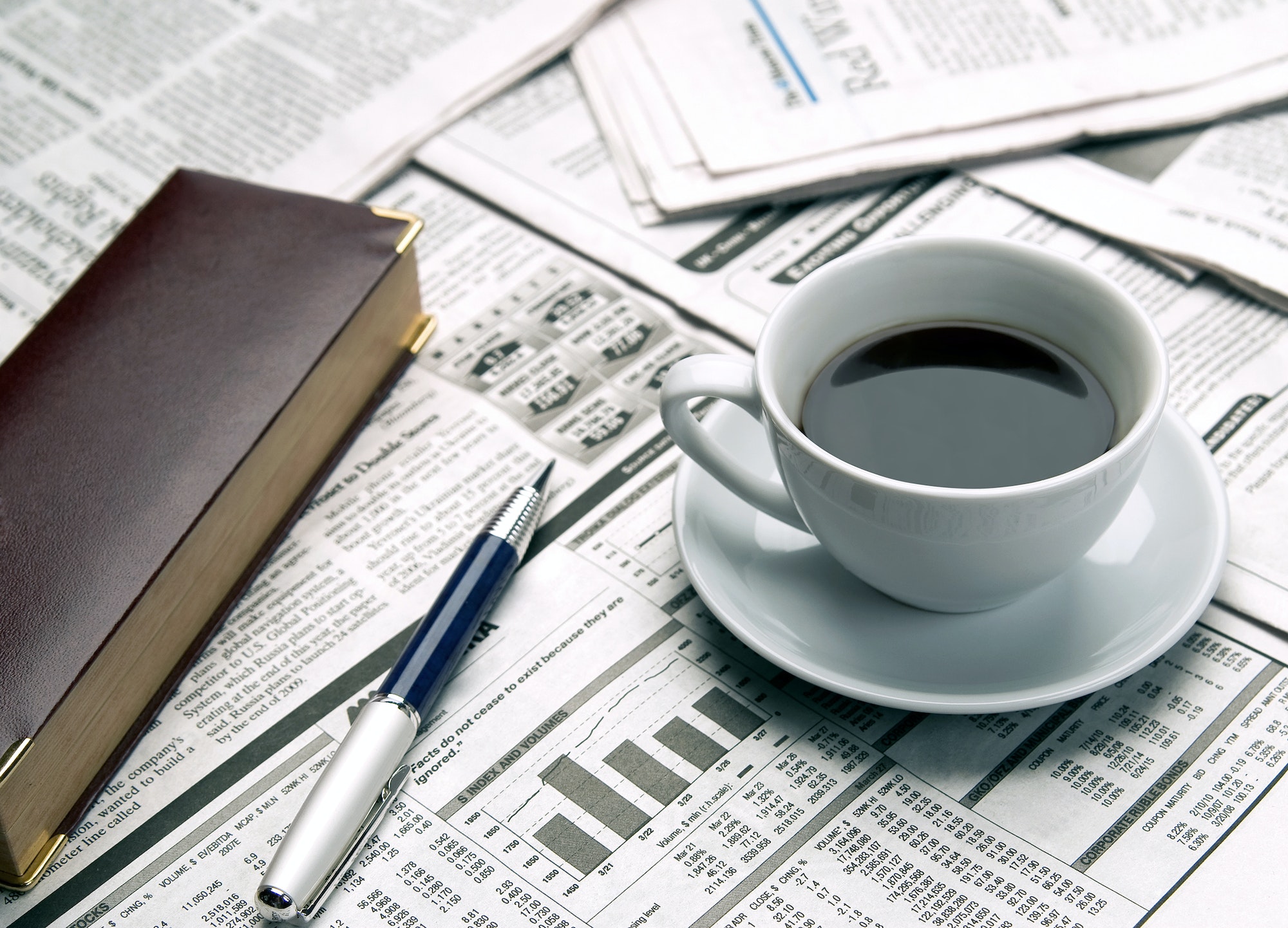 Cup of coffee on the newspaper